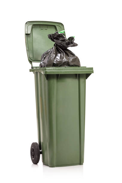 istock Studio shot of a green garbage bin with a plastic bag inside 1248750649