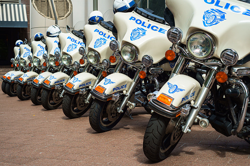 Charlotte, North Carolina USA - October 10, 2013: Charlotte police department motorcycles lined up outside a municipal downtown building.