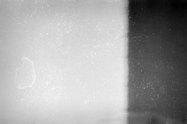 istock Noisy film frame with heavy scratches, dust and grain 1248753893