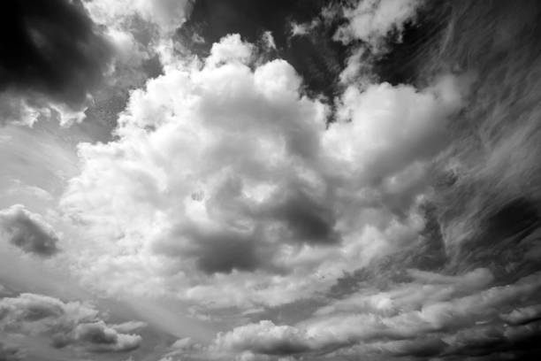 Grunge image of sky with clouds with grain. Retro looking sky with clouds.