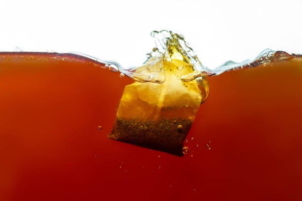 istock Closeup process of making paper bag black tea. 1248755218