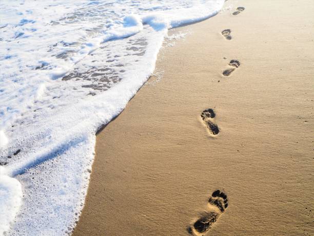 Australia, south of Perth, man walking to water.