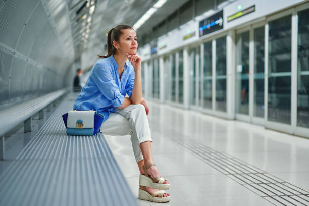 istock young woman with a handbag in metro station 1248759989
