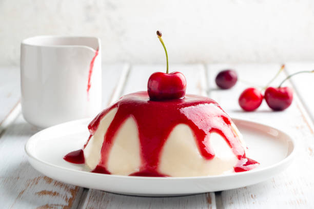 istock Delicious panna cotta with cherry sauce 1248760668