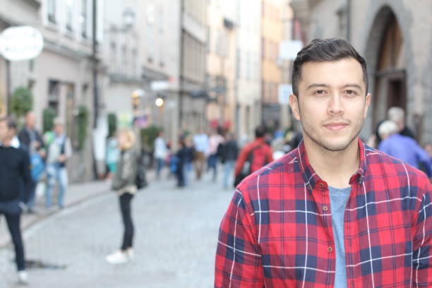 istock Young urban man walking on the street 1248761689