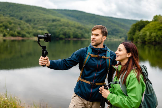 istock Charming travel couple vlogging for their channel while exploring nature 1248761761