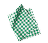 Green checkered folded cloth isolated,kitchen picnic towel top view.