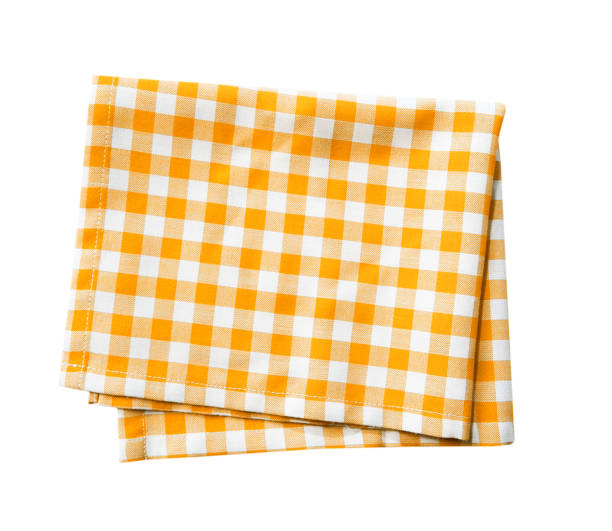 Yellow checkered folded cloth isolated,kitchen picnic towel. Yellow checkered folded cloth isolated,gingham checked kitchen towel,picnic decoration element. napkin stock pictures, royalty-free photos & images