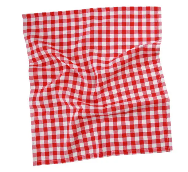 Photo of Red checkered square towel top view.Picnic blanket.Dish cloth isolated.