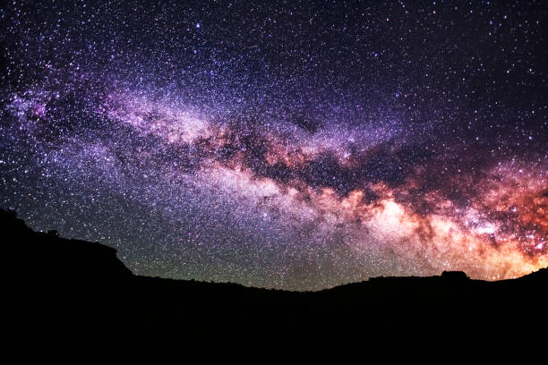 istock Beautiful starry sky with bright milky way galaxy. Night landscape. Astronomical background. 1248765988