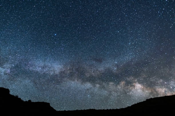 istock Beautiful starry sky with bright milky way galaxy. Night landscape. Astronomical background. 1248766029