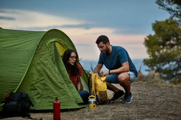 istock Spanish Backpackers Preparing Tent for Overnight Stay 1248766164