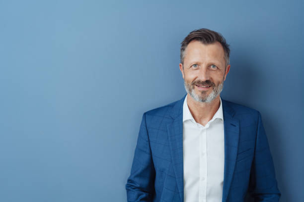 istock Smart friendly businessman smiling at the camera 1248767732