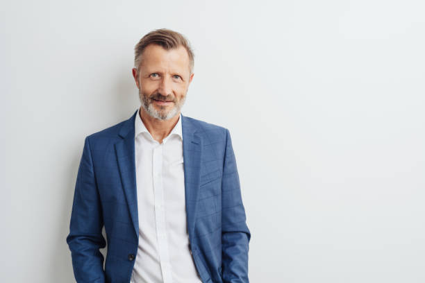 istock Thoughtful businessman scrutinising the camera 1248768420