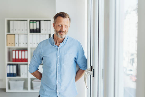 istock Relaxed smiling businessman in shirt sleeves 1248768427