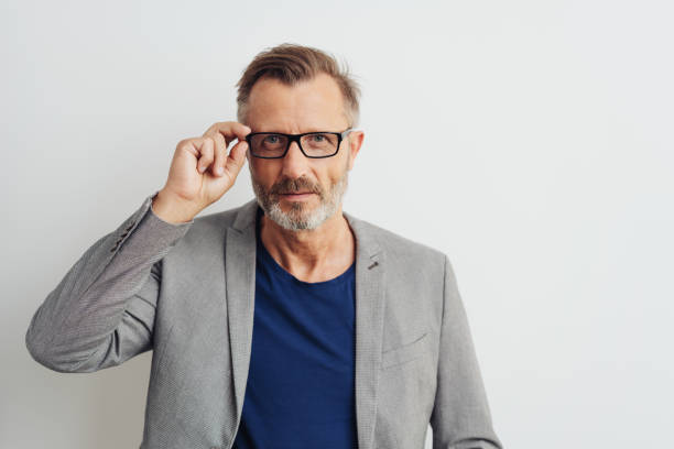 istock Man wearing glasses staring intently at the camera 1248768505