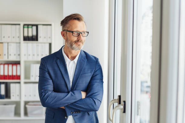 istock Confident thoughtful businessman standing waiting 1248768796