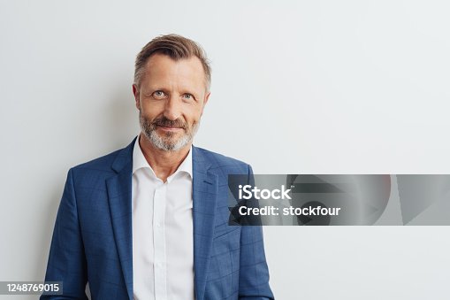istock Middle-aged man in blue blazer, copy space 1248769015