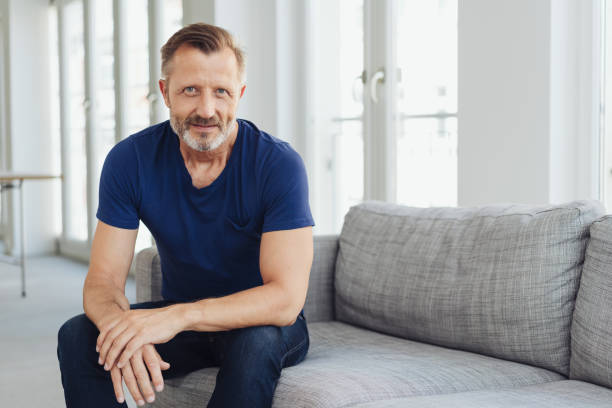 istock Attractive middle-aged man staring at camera 1248769245