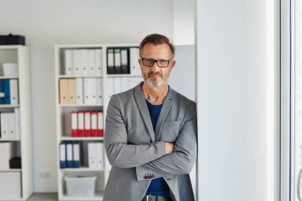 istock Worried businessman staring intently at the camera 1248769713