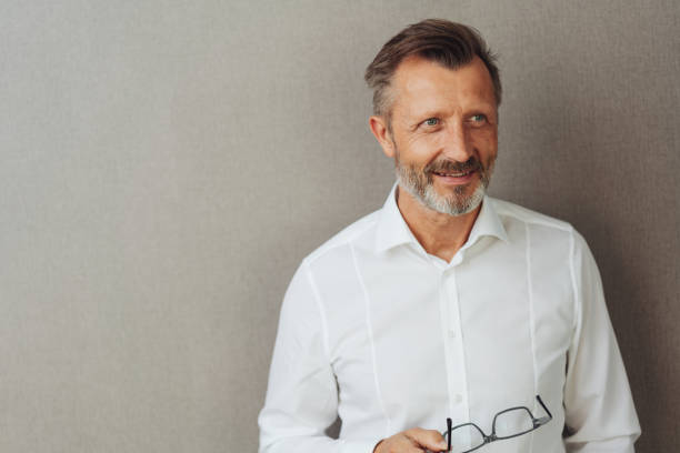istock Thoughtful man looking up off to the right side 1248770490