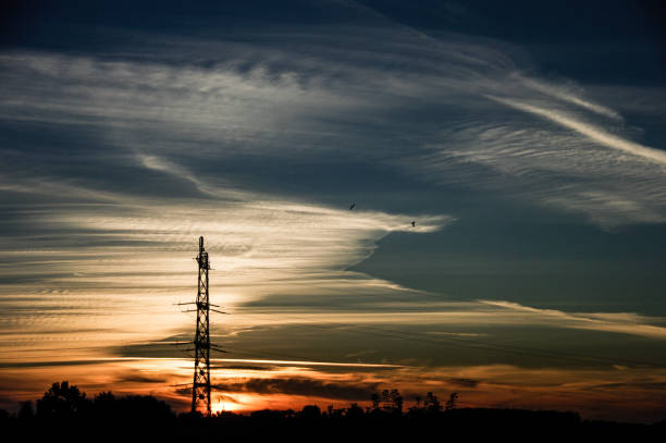 istock Electric pylon in silhouette 1248770638