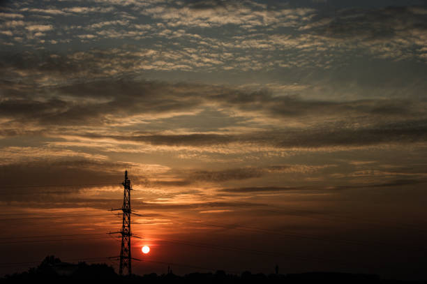 istock Electric pylon in silhouette 1248770641