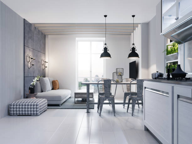 istock Dining room with dining table and sitting area with sofa in a modern white loft style kitchen. 1248772469