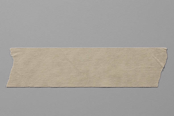 istock Masking Tape Close Up on Grey Background with Real Shadow. 1248773990