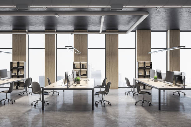 istock Coworking office interior room with computers and city view. 1248775710