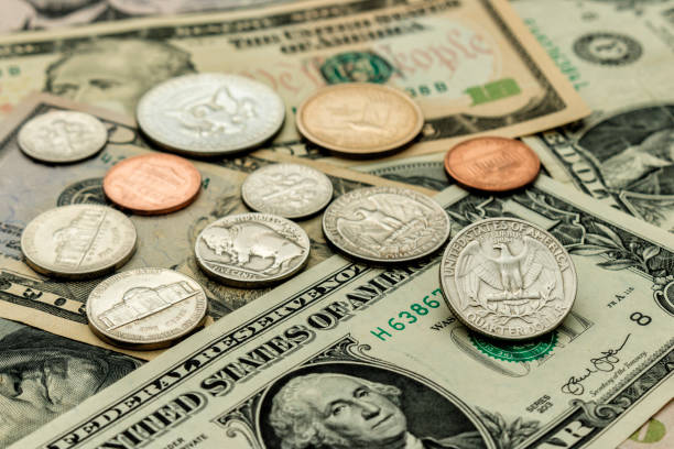 istock background of banknotes and coins 1248776214