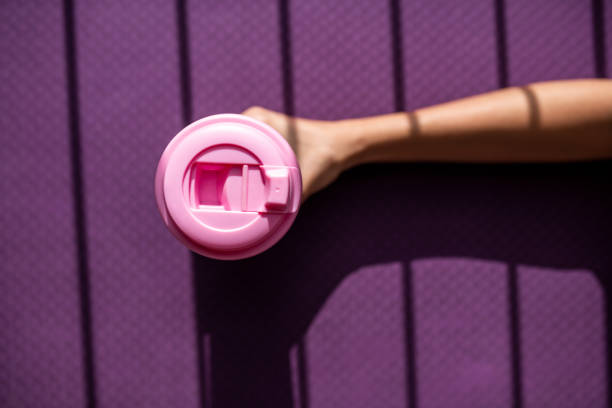 istock Overview of a reusable cup on a purple background. 1248776232