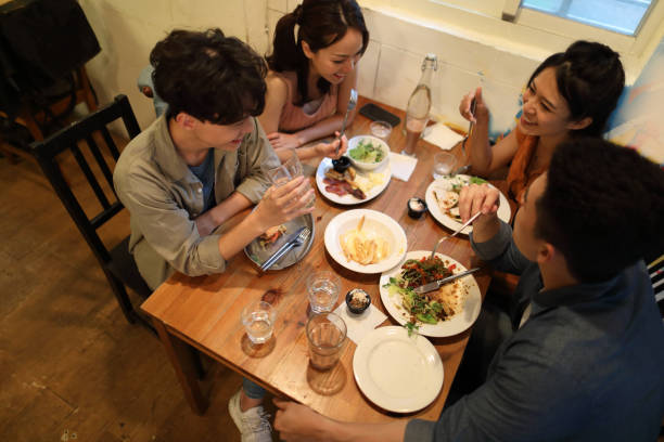 istock young people enjoying lunch in restaurant 1248776947