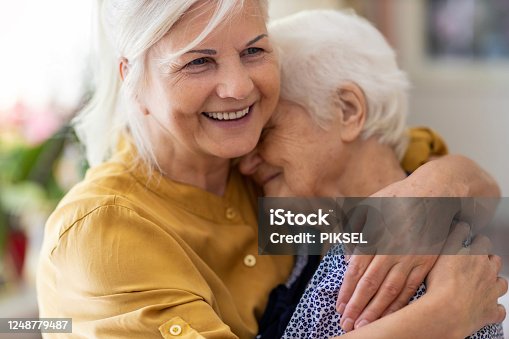 istock Woman spending time with her elderly mother 1248779487