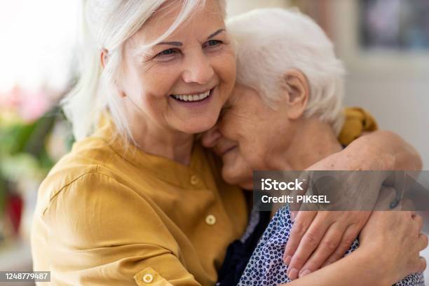 Woman Spending Time With Her Elderly Mother Stock Photo - Download Image Now - Senior Adult, Healthcare Worker, Family