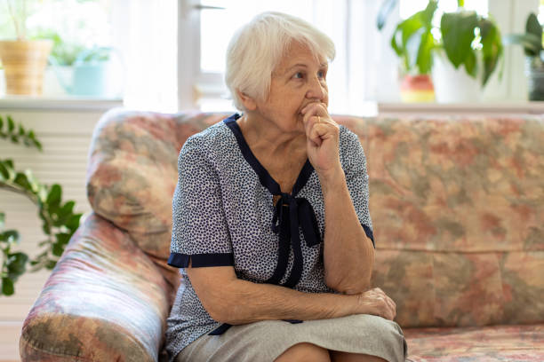 istock Elderly woman looking sad 1248779668