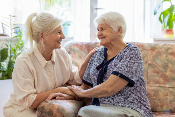 istock Woman spending time with her elderly mother 1248780033