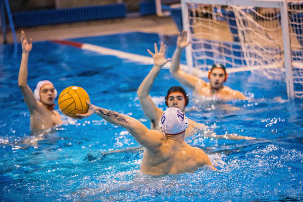 istock Young men playing water polo 1248780231