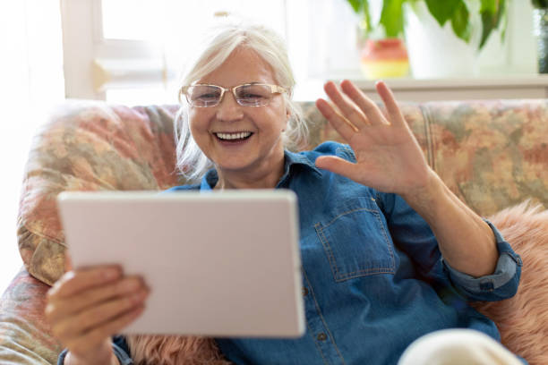 istock Senior woman using digital tablet at home 1248780781