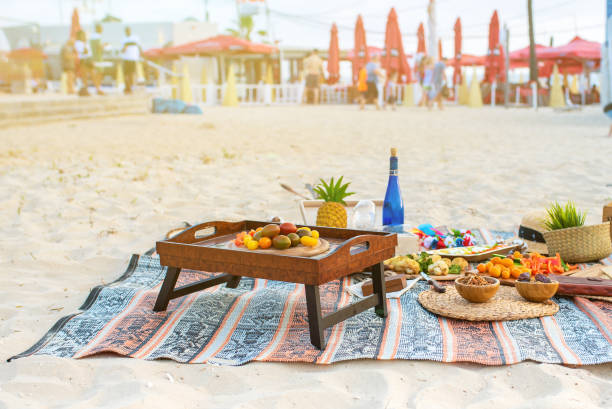 istock Beautiful summer picnic on the beach at sunset in zero waste style. Eco friendly idea for weekend staycations 1248781378