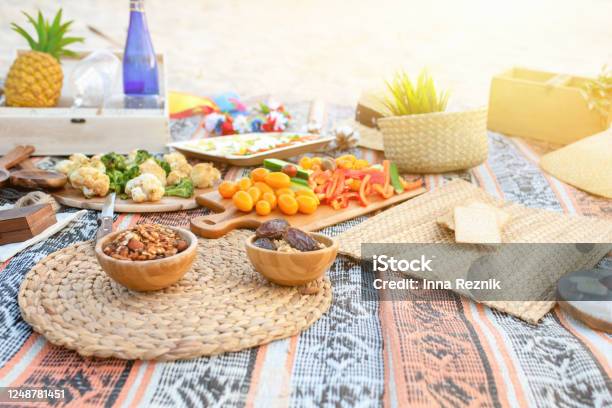 Beautiful Summer Picnic On The Beach At Sunset In Zero Waste Style Eco Friendly Idea For Weekend Staycations Stock Photo - Download Image Now
