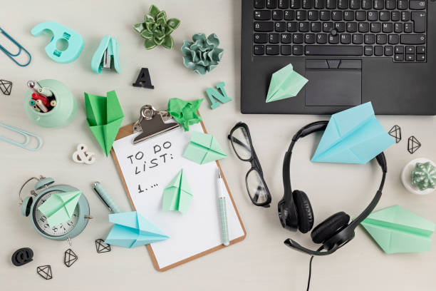 istock top view over desk top daily planner and notebook. Procrastination, waste of time, time management, home office organization idea 1248782358