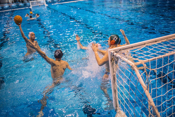 istock Young men playing water polo 1248782386