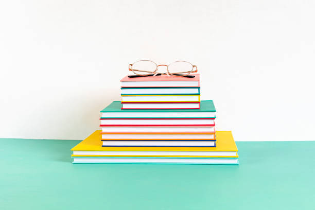 istock Pile of colorful books and notebooks. Education, study, learning, teaching idea 1248782440