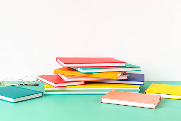 istock Pile of colorful books and notebooks. Education, study, learning, teaching idea 1248782451