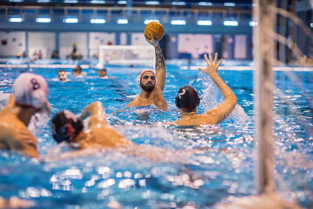 istock Young men playing water polo 1248782561