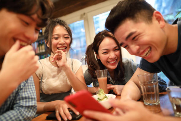 istock Sharing funny memories on smart phone 1248782613