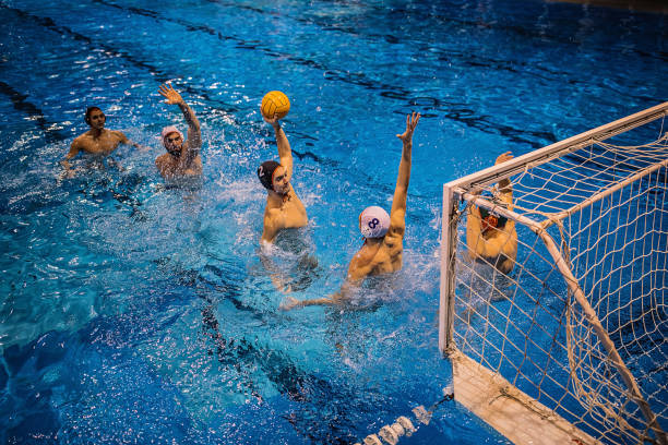 istock Young men playing water polo 1248782620