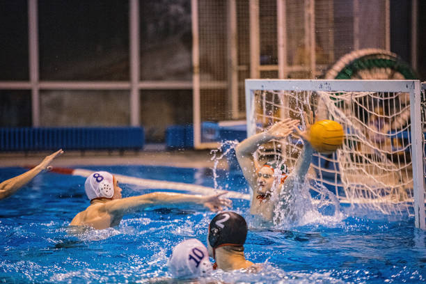 istock Young men playing water polo 1248783385