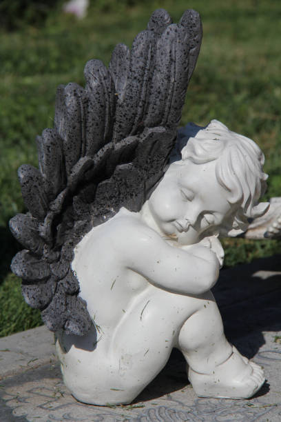 istock statue of baby angel 1248783605
